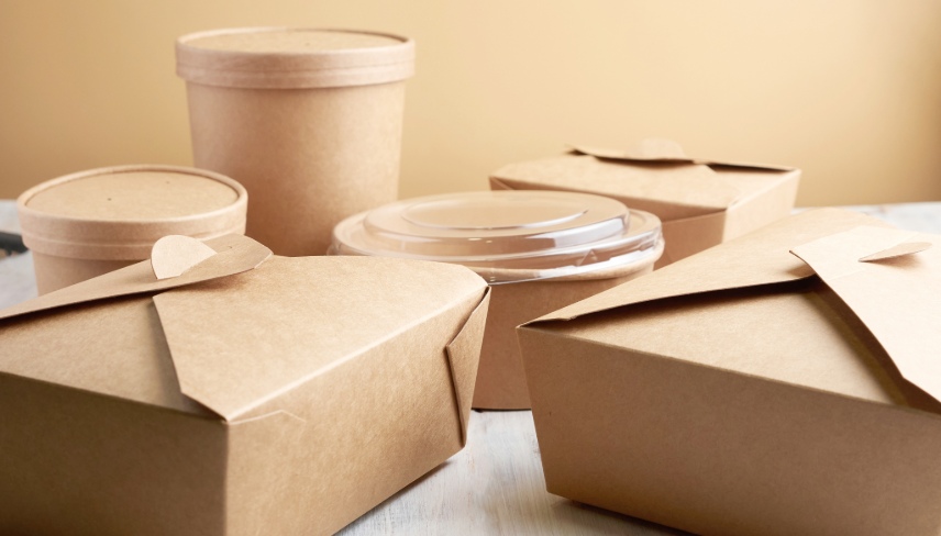 paper containers for takeaway food, isolated on a wooden table