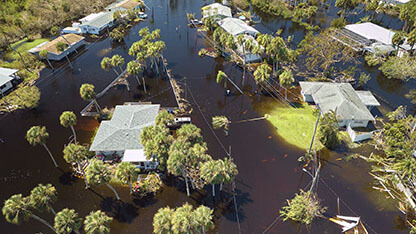 Hurricane Ian flooded houses in Florida residential area. Natural disaster and its consequences.