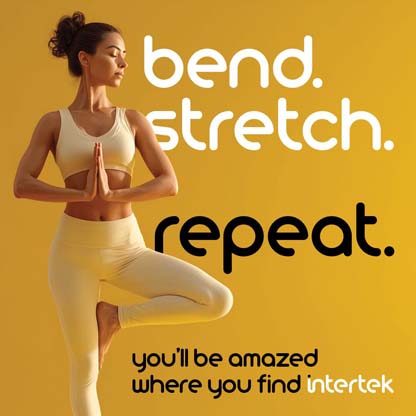 Woman balancing on one leg with hands together in yoga outfit